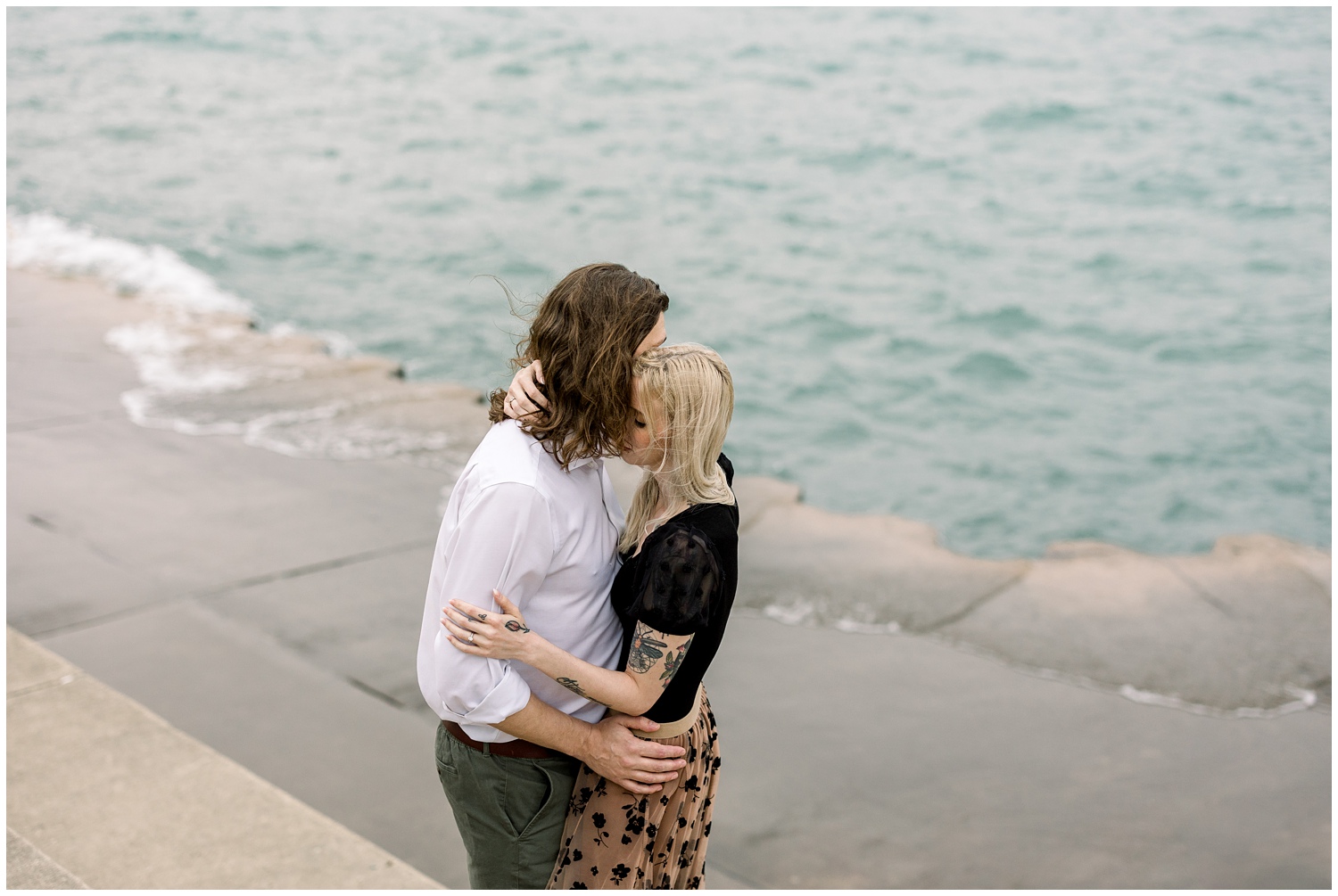 Couple hugging at the lake
